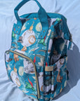 Colorful parents backpack with disney inspired design on a white background