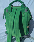Green backpack on a light background