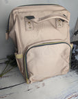 Rose gold backpack for baby changing