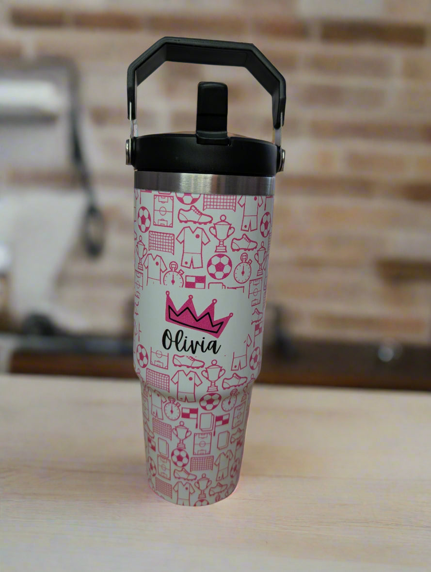 a pink, personalised water bottle in football pattern.