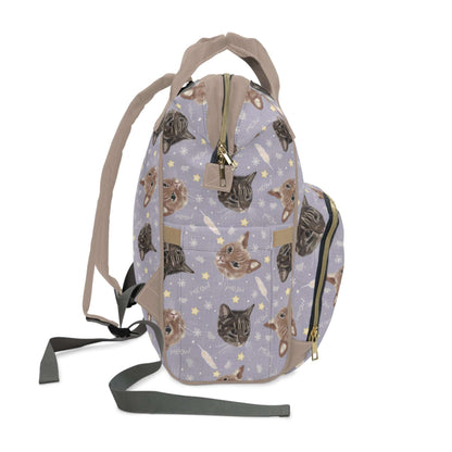 Purple baby changing backpack with adorable cat and kitten illustrations.