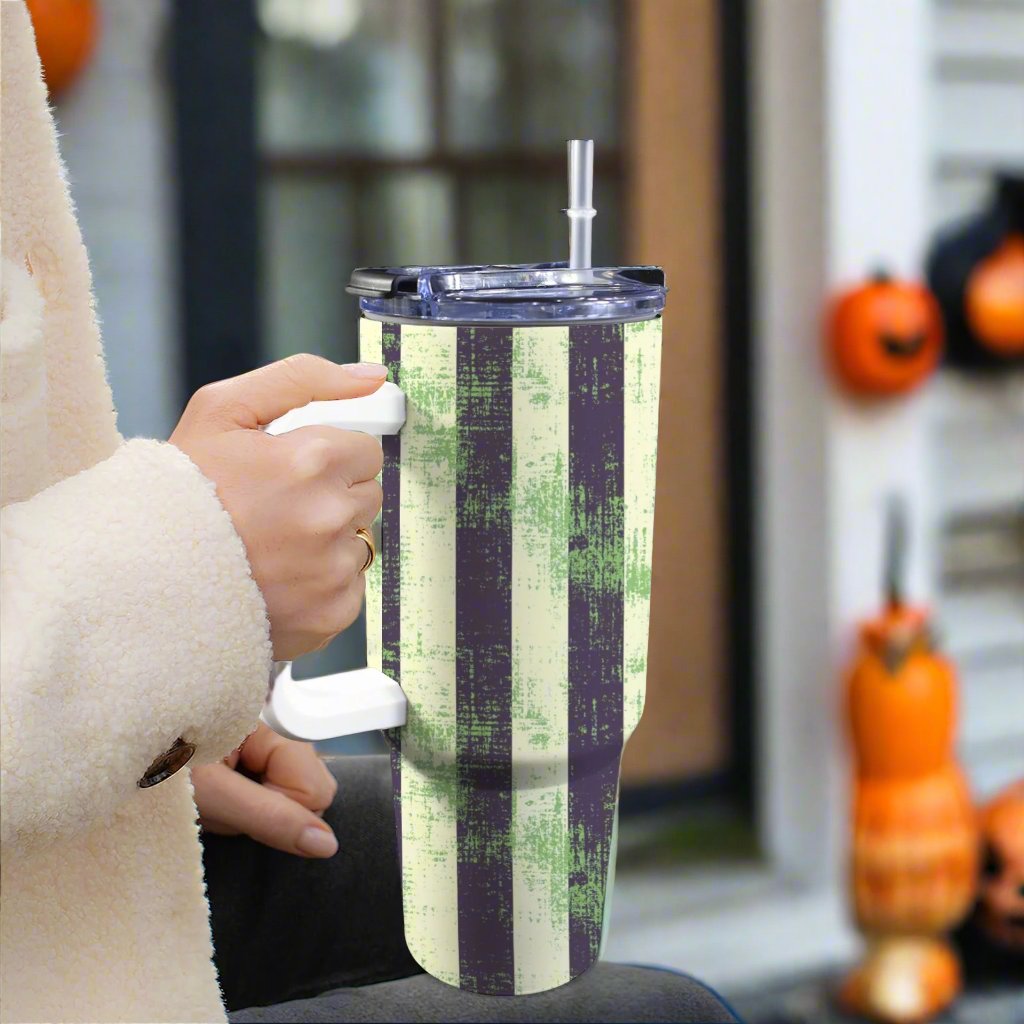 Woman out trick or treating with a halloween stanley cup