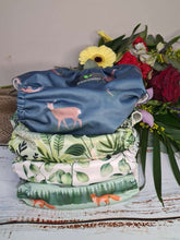 Load image into Gallery viewer, green pile of cloth nappies
