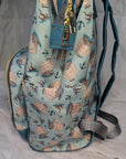 Backpack with nautical pattern on a light background showing side pocket