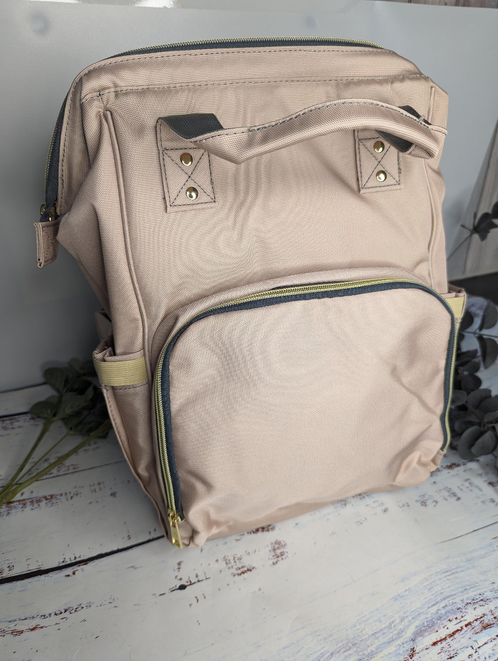 Rose gold backpack for baby changing