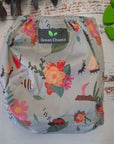 Creeping It Real Green Cheeks Cloth Nappy, a washable nappy featuring cute insects