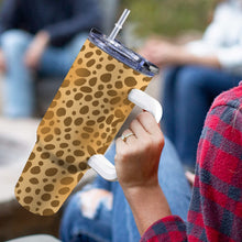 Load image into Gallery viewer, Lifestyle image of personalised Stanley-style tumbler with colourful patterns, ideal for on-the-go mums

