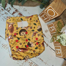Load image into Gallery viewer, Green A photograph of cloth diaper pocket nappies and hemp boosters, illustrating their eco-friendly and adjustable design. Cloth Hemp Reusable Nappy in mustard. 
