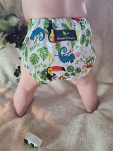 Load image into Gallery viewer, Baby wears a reusable cloth nappy standing 
