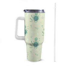 Load image into Gallery viewer, Front view of 40oz turtle tortoise Stanley-style tumbler with a white handle, featuring exclusive colourful patterns
