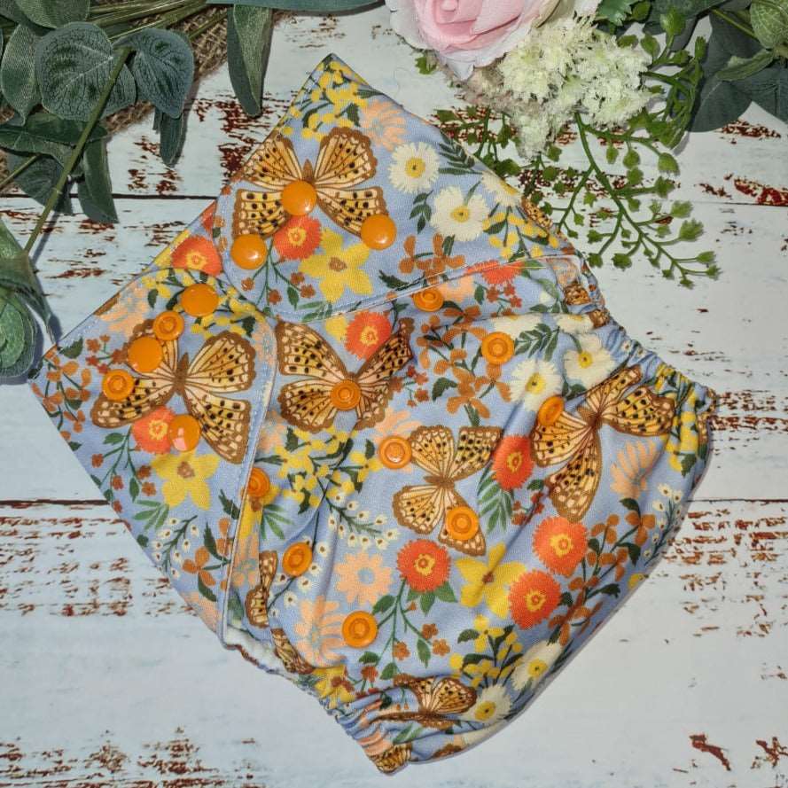 Green Cheeks Cloth Hemp Reusable Nappy in a vintage inspired floral print with butterflies