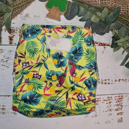 Green Cheeks Cloth Hemp Reusable Nappy in yellow with parrots and tropical birds