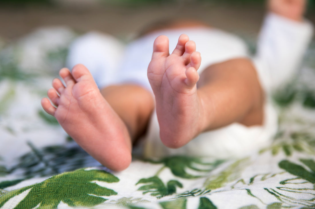 Cute baby feet in this Green Cheeks colourful shop for new parents