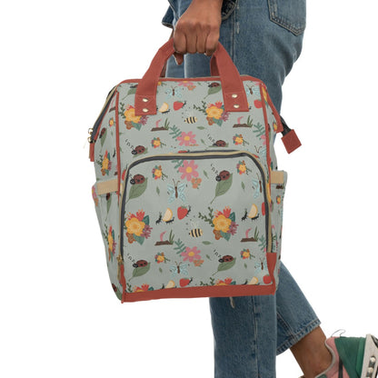 Insect-themed unique baby changing backpack with charming bug illustrations.