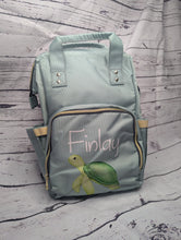 Load and play video in Gallery viewer, A video of Green Cheeks personalised baby changing nappy bags
