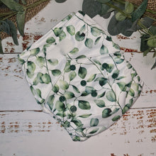 Load image into Gallery viewer, A Green Cheeks cloth nappy in botanical leaf print.

