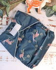 A picture of cloth washable pocket nappies with hemp boosters, featuring a woodland deer.