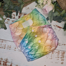 Load image into Gallery viewer, A snapshot of cloth diapers with hemp boosters, an environmentally conscious diapering solution in a colourful mermaid print
